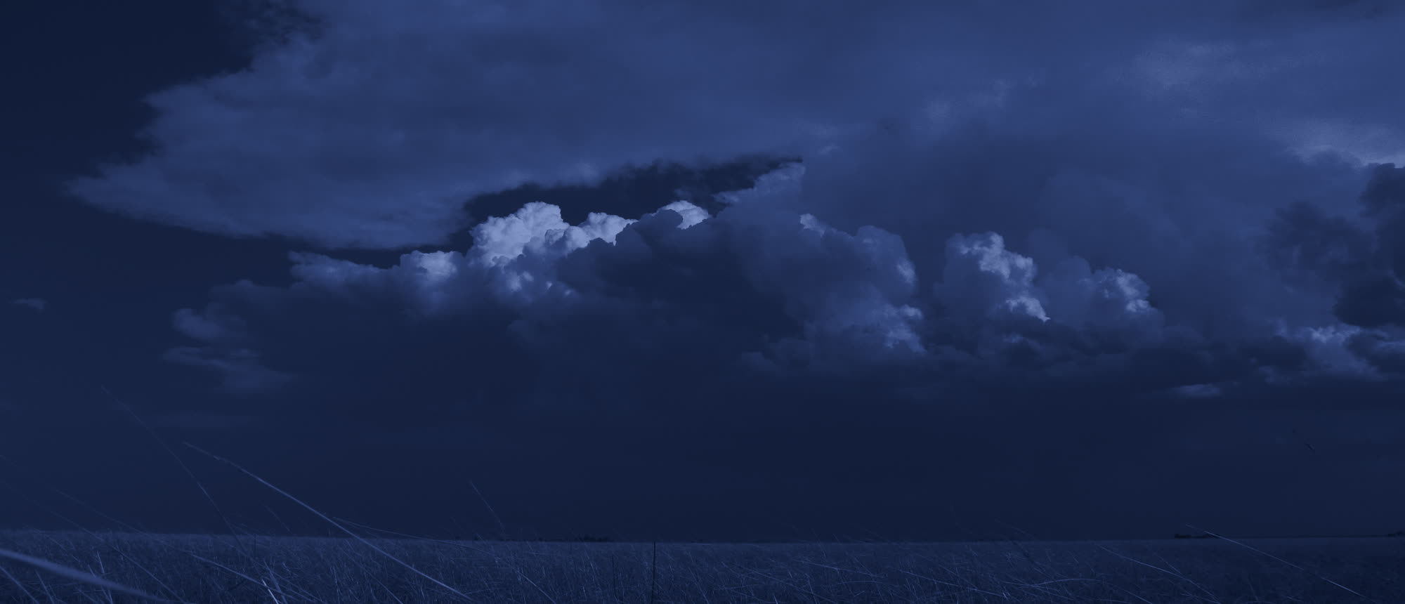 Storm clouds building over open plains